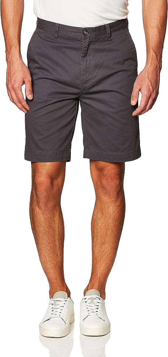 Man wearing black shorts and white shoes