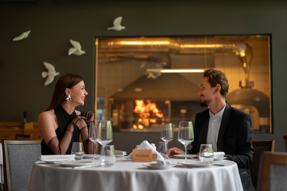 Couple smiling at each other in a fine dining