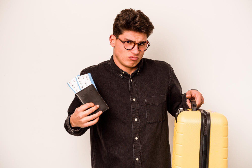 Man carrying a luggage and boarding pass