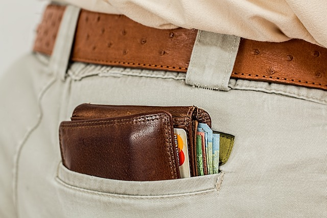 Wallet full of cash in a pocket