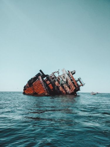 sunken rusty ship on cape