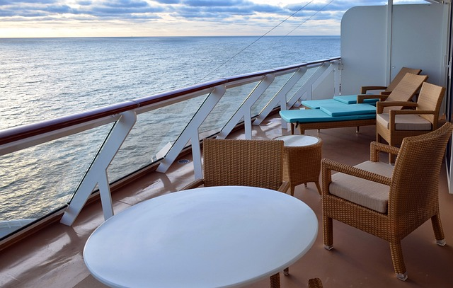 Chairs and tables on a balcony of a ship cabin