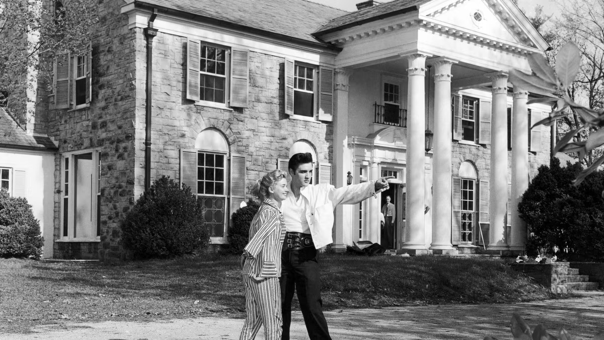 Elvis Presley and a woman on a black and white photo