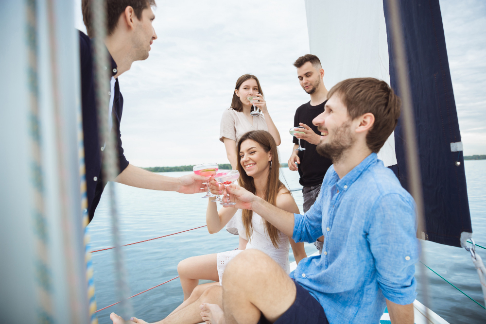 Group of friends having a drink on a ship