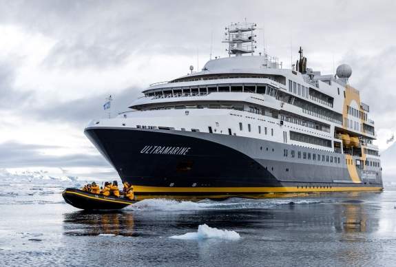 Quark Expeditions ship with people in Antarctica
