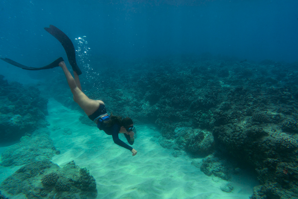 Woman freediving with flippers