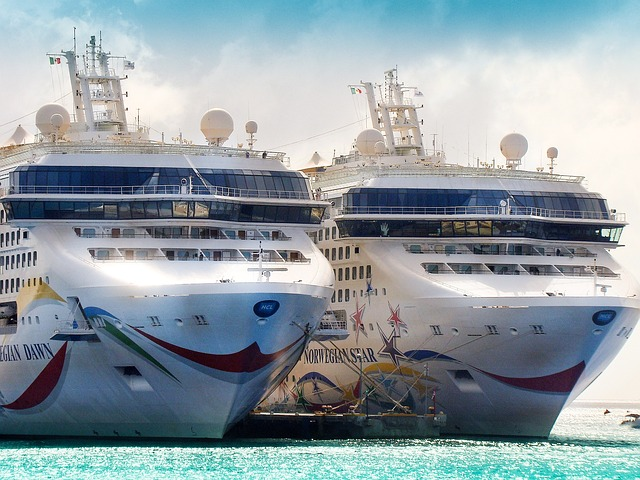 norwegian cruise ships docked beside each other