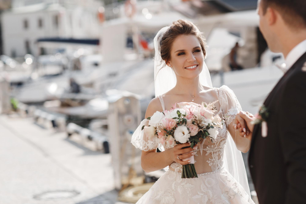 bride holding flowers in a port