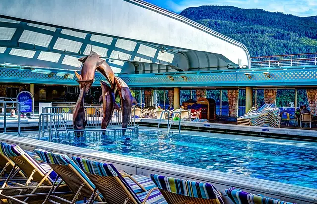 cruise ship pool deck with a dolphin statue
