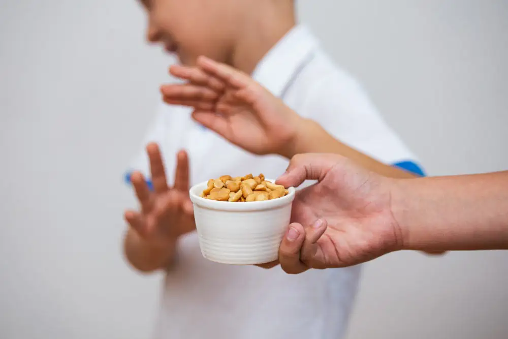kid rejecting peanuts